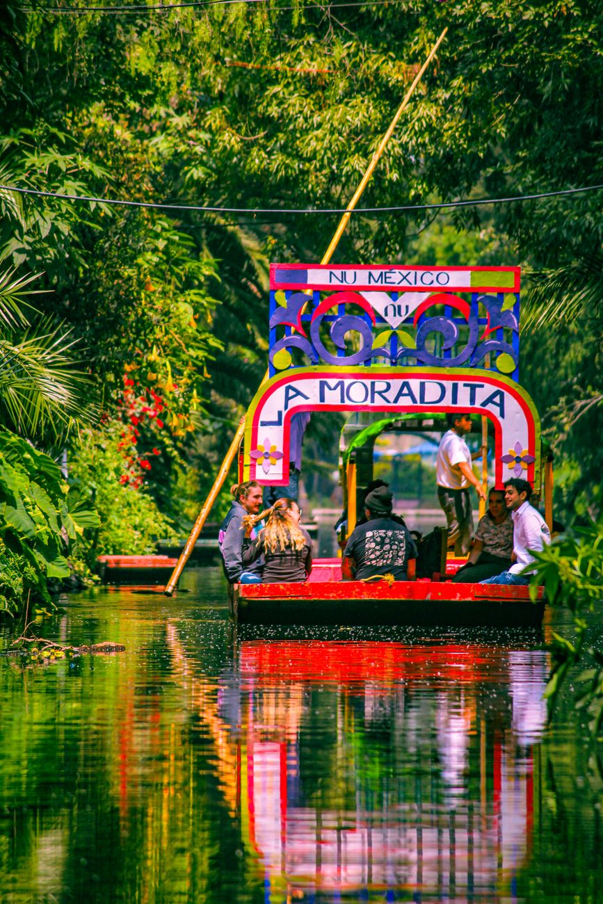 Experience the vibrant trajineras in Xochimilco, Mexico City's UNESCO World Heritage Site.