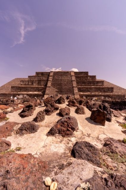 The Pyramid of the Moon at Teotihuacan under a clear sky, showcasing ancient architecture.